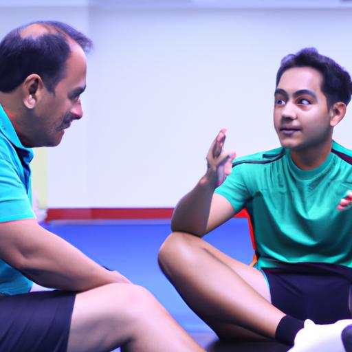 Bố huấn luyện viên malaysia hướng dẫn một vận động viên trẻ.