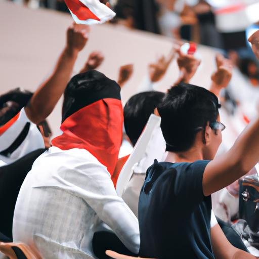 Nhóm cổ động viên cổ vũ cho đội bóng của mình trong trận đấu tại Asian Cup.