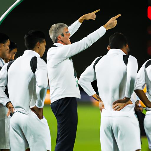Huấn luyện viên chỉ dẫn đội bóng của mình trong trận đấu tại Asian Cup.