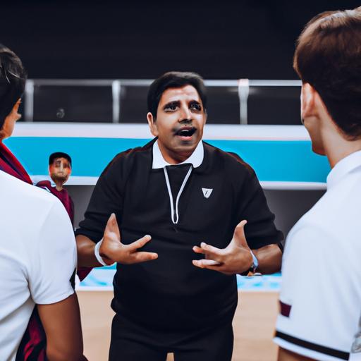 Huấn luyện viên Qatar chỉ đạo cho đội bóng của mình trong giờ nghỉ giữa hiệp đấu.