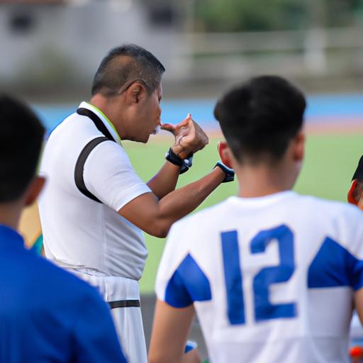 Huấn luyện viên Thái Lan chỉ đạo cầu thủ trong trận đấu