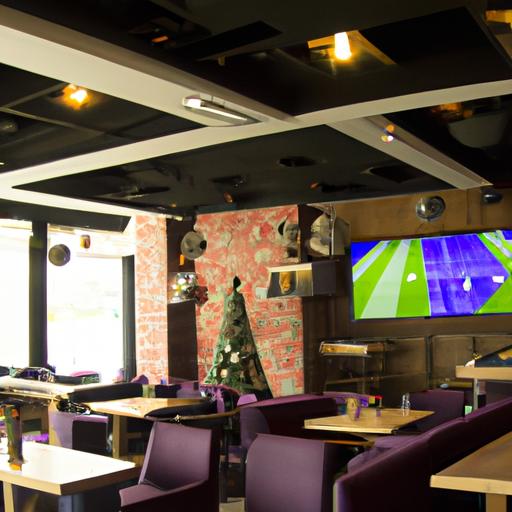 Một cái nhìn về quán cafe với trang trí chủ đề bóng đá và màn hình lớn chiếu trận đấu
