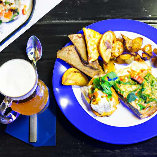 Một đĩa đồ ăn ngon và một chai bia trên bàn tại quán cafe với chủ đề thể thao